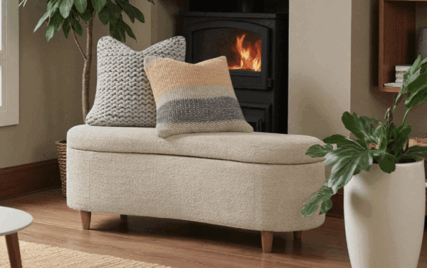 Solomon upholstered storage bench with walnut legs and hinged storage top.