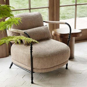 Muirfield sculptural metal accent chair designed by Jake Arnold with checkerboard fabric and hammered steel frame.